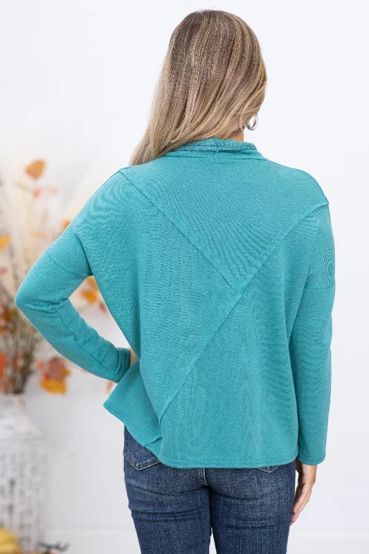 turquoise-mock-neck-top-with-seam-detail